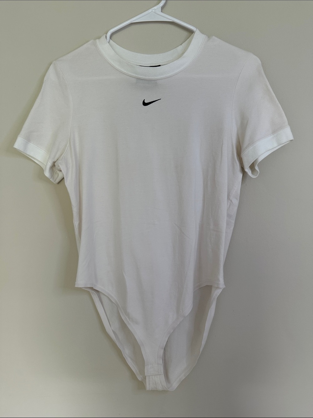 Nike White Woman’s Short-Sleeve Stretch Bodysuit with Black Swoosh